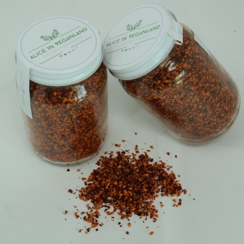 Ajonjolí enchilado guajillo. Frasco con 120 gramos.
